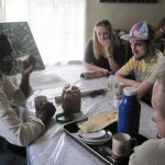 Another of the Saint Soleil artists entertains us by sharing tea and cassava