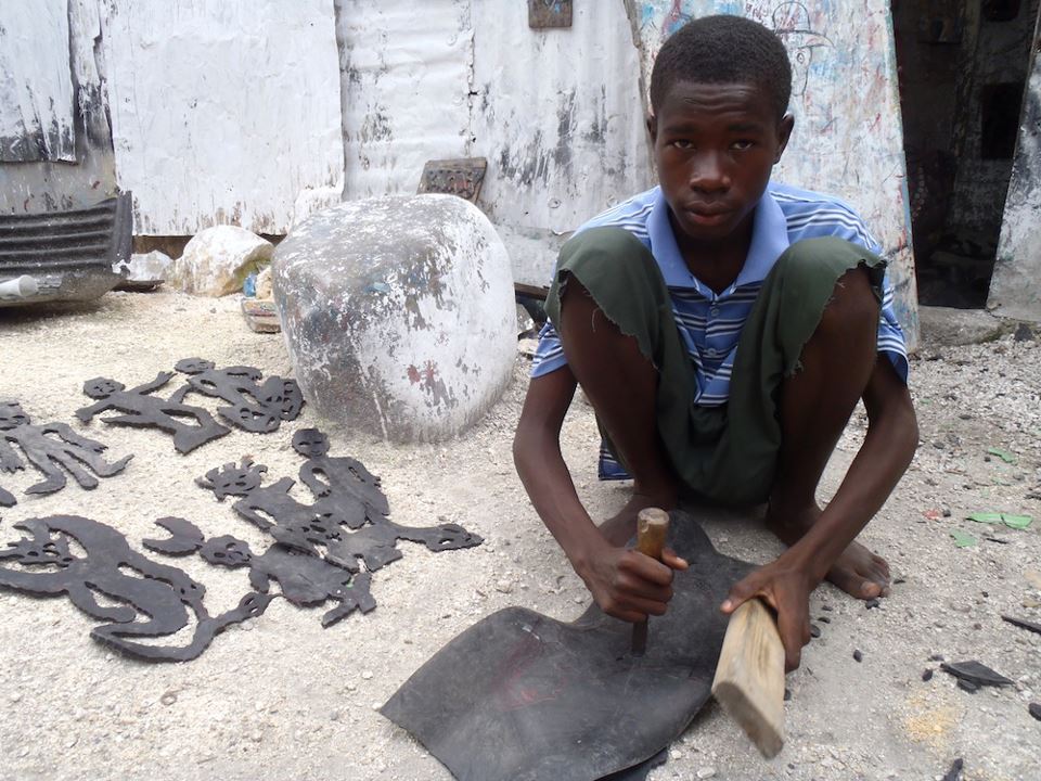 One of the kids making art at the Grand Rue. Photo thanks to Haiti: The Bradt Travel Guide