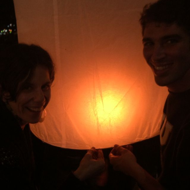 Eli helping me hold my lantern as it fills with hot air.