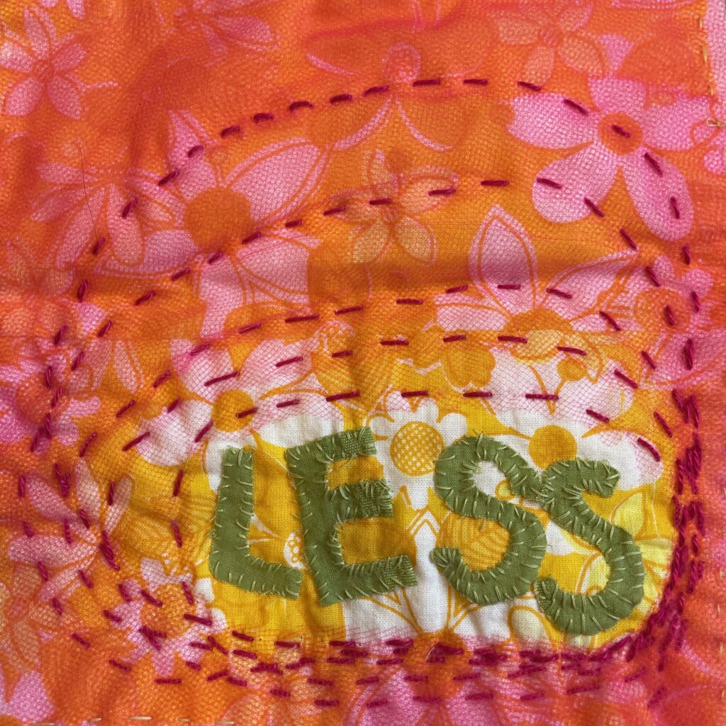 pic of embroidered word LESS